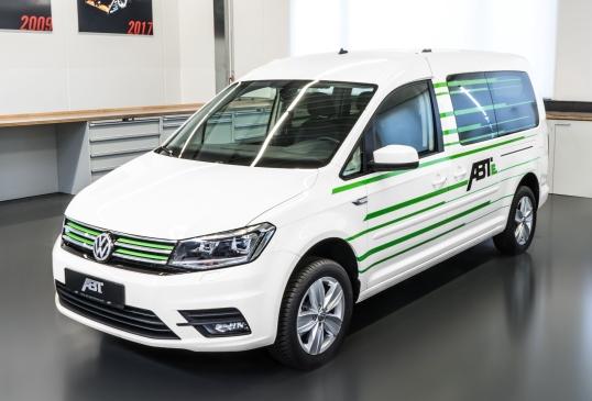 White Volkswagen van with green striped details