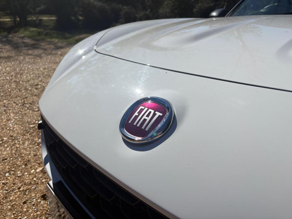 Fiat 124 Spider Photo at-a75f29a5f9ba42f68a854717dfc4b593.jpg